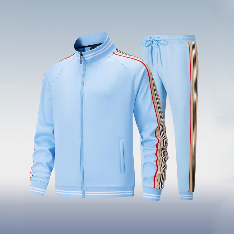 Light blue tracksuit with striped side panels on a gradient background