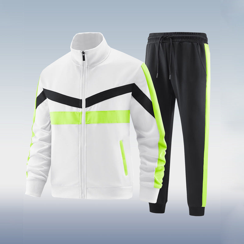 White tracksuit with black and green accents on a light gray background
