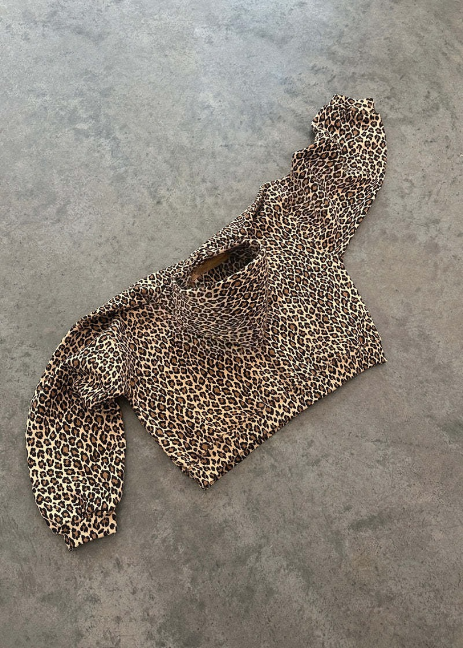 Leopard print scarf on a gray surface