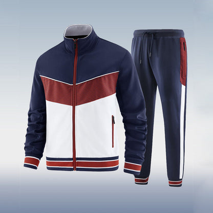 Navy, white, and red tracksuit on a light gray background