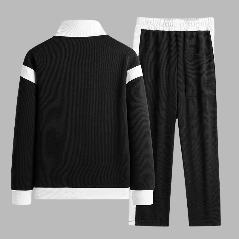 Black and white tracksuit on a gray background