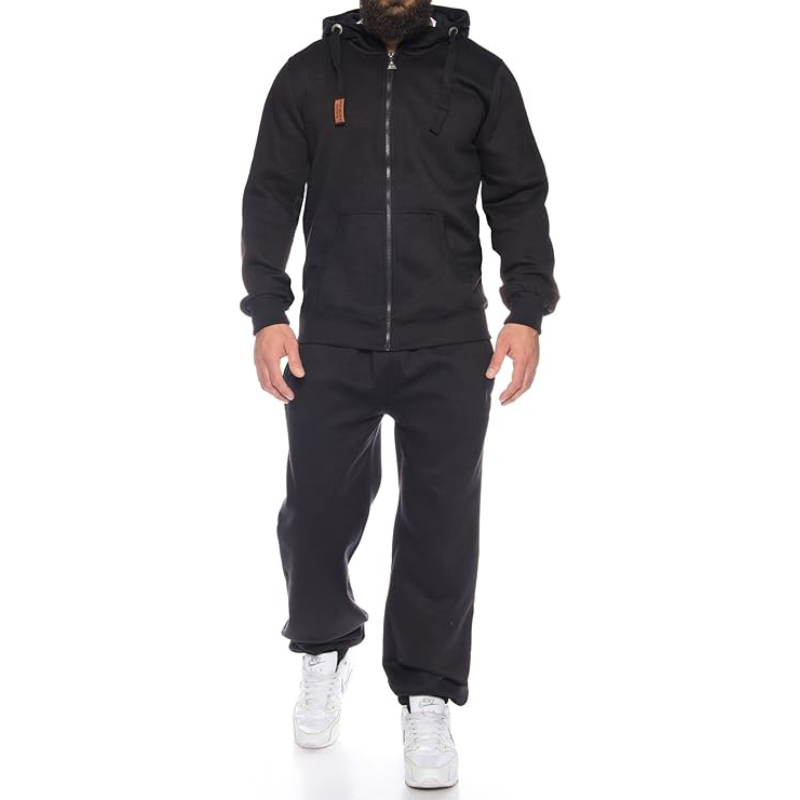 Person wearing a black tracksuit with a hood on a white background