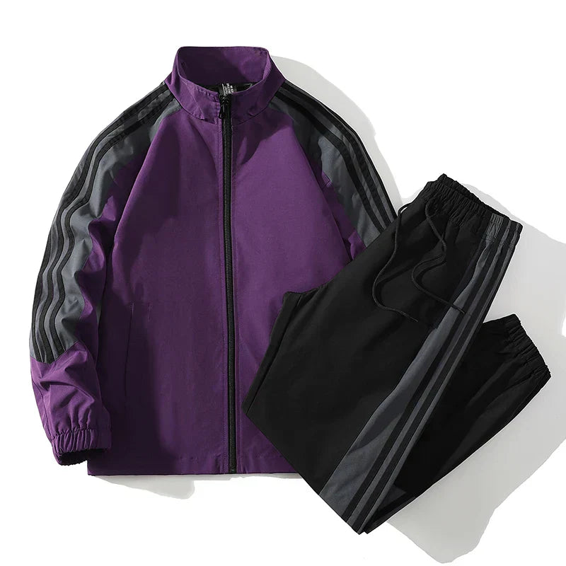 Purple tracksuit with black pants on a white background