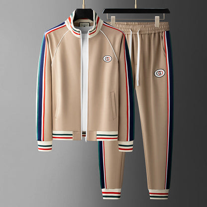 Beige tracksuit with colorful stripes on a gray background