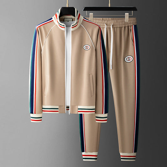 Beige tracksuit with colorful stripes on a gray background
