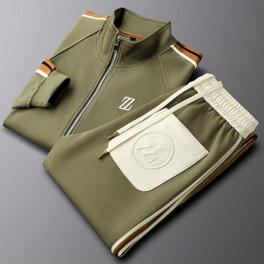 Folded green tracksuit with a logo on a gray background