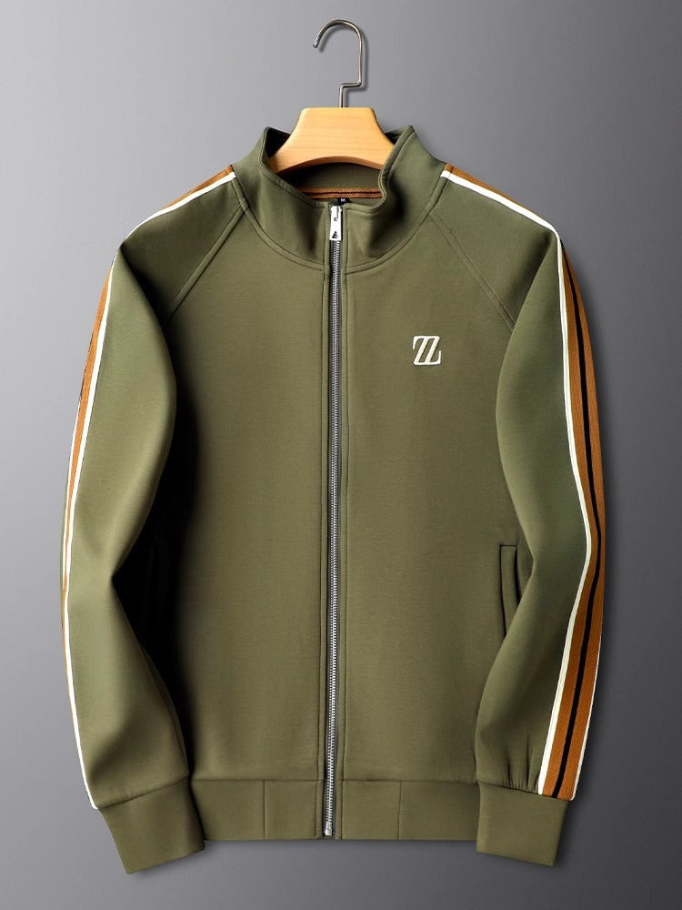 Green jacket with a logo on a hanger against a gray background