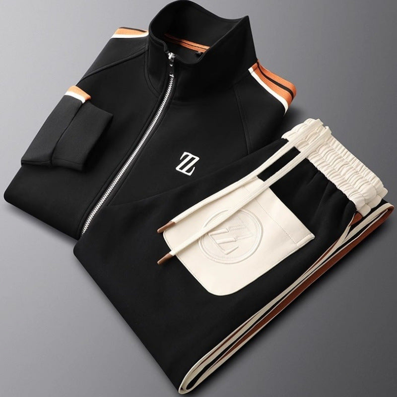Black and white tracksuit with a logo on a gray background