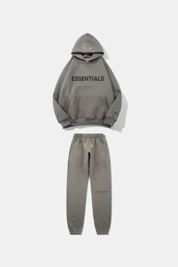 Gray hoodie and jogger pants set with 'ESSENTIALS' text on a white background