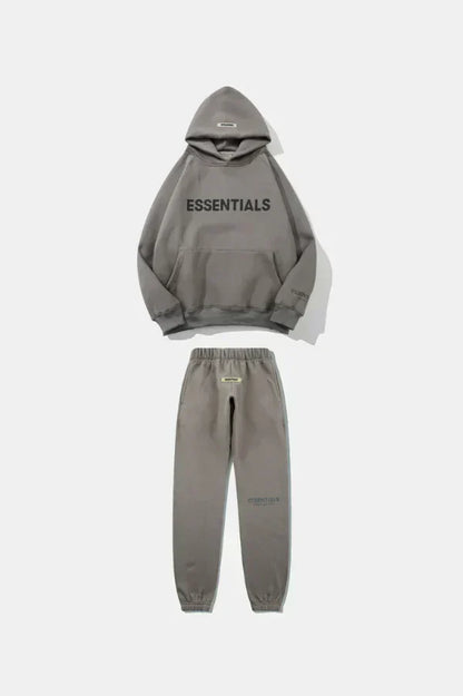 Gray hoodie and jogger pants set with 'ESSENTIALS' text on a white background