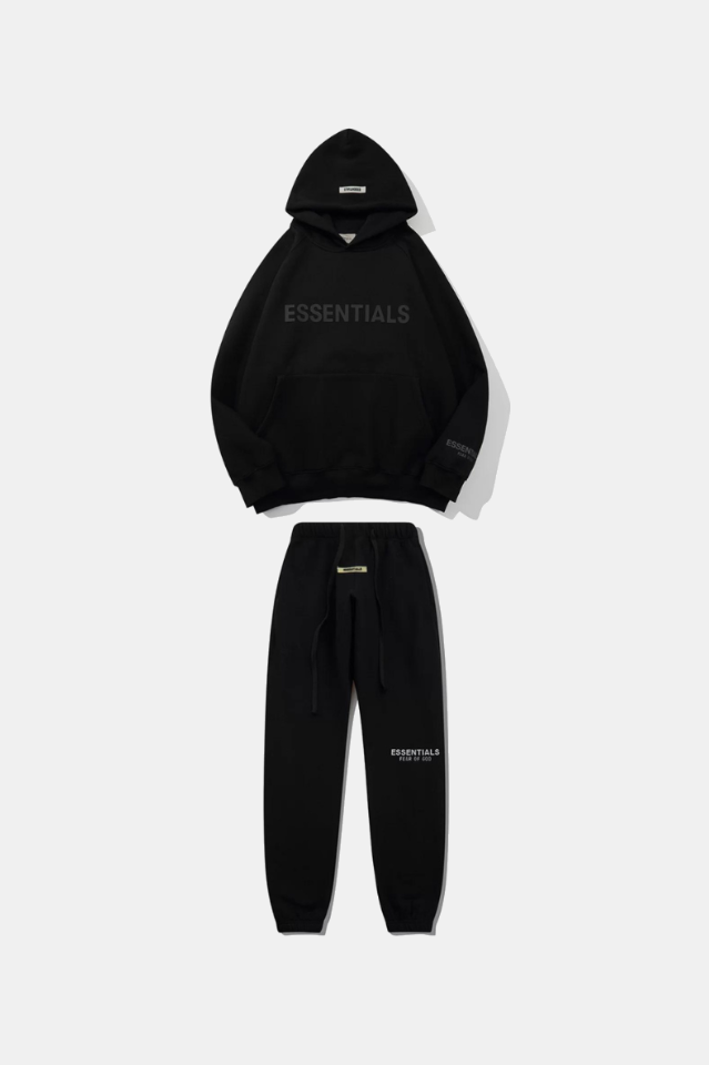 Black hoodie and jogger set with 'ESSENTIALS' branding on a white background