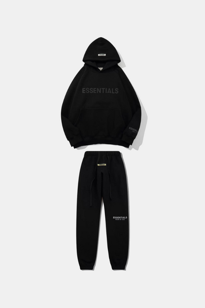 Black hoodie and jogger set with 'ESSENTIALS' branding on a white background