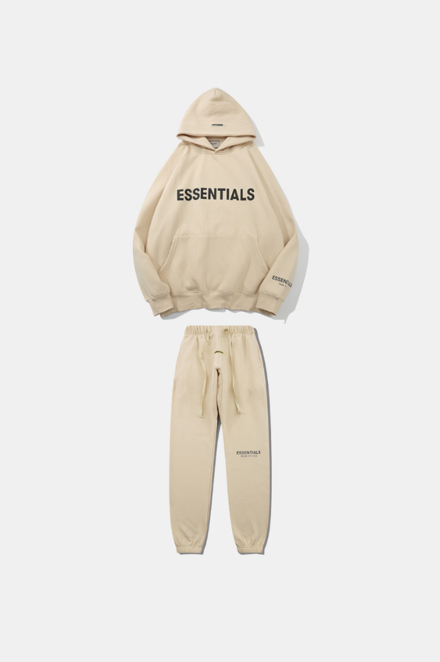 Beige hoodie and jogger set with 'ESSENTIALS' text on a white background