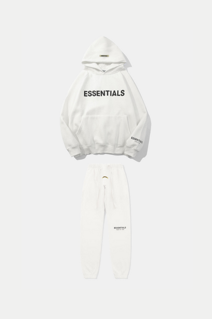 White hoodie and pants set with 'ESSENTIALS' text on a white background