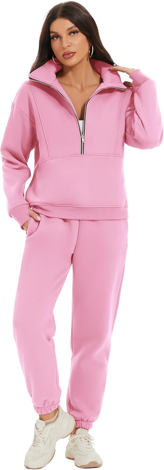 Woman wearing a pink tracksuit with a white background