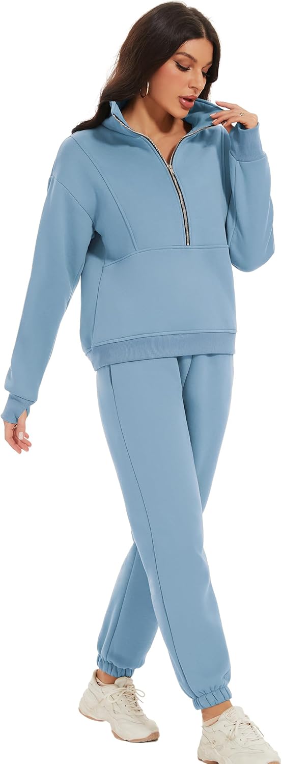 Woman wearing a light blue tracksuit on a white background