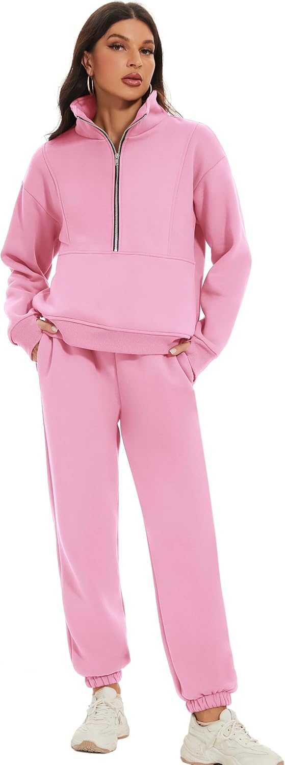Woman wearing a pink tracksuit on a white background