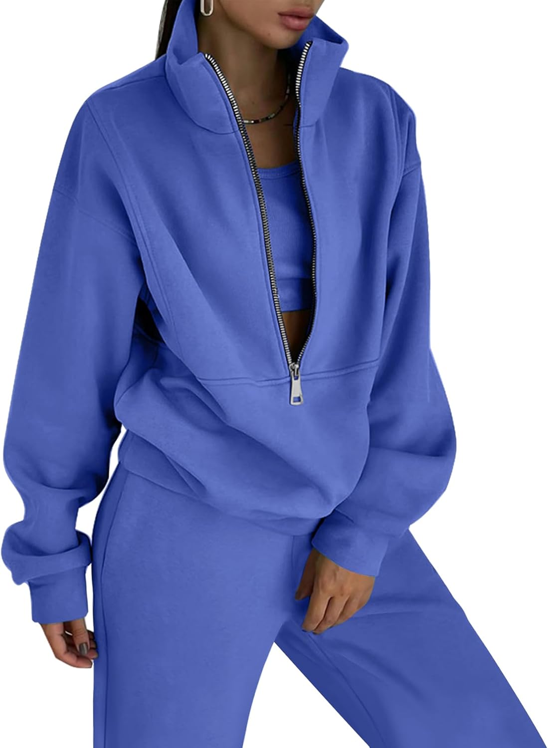 Blue tracksuit worn by a model on a white background