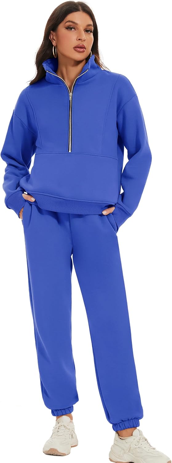 Woman wearing a blue tracksuit with a white background