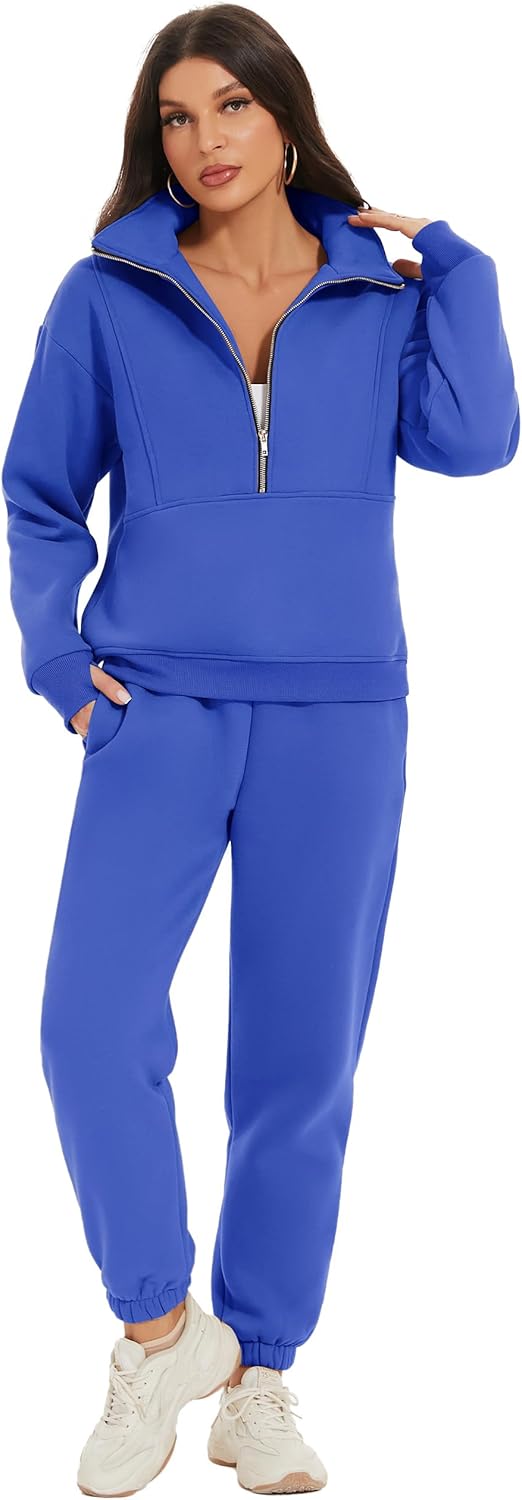 Woman wearing a blue tracksuit with a hood and jogger pants.