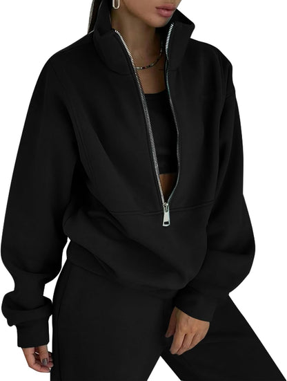Black zip-up hoodie worn by a person on a white background