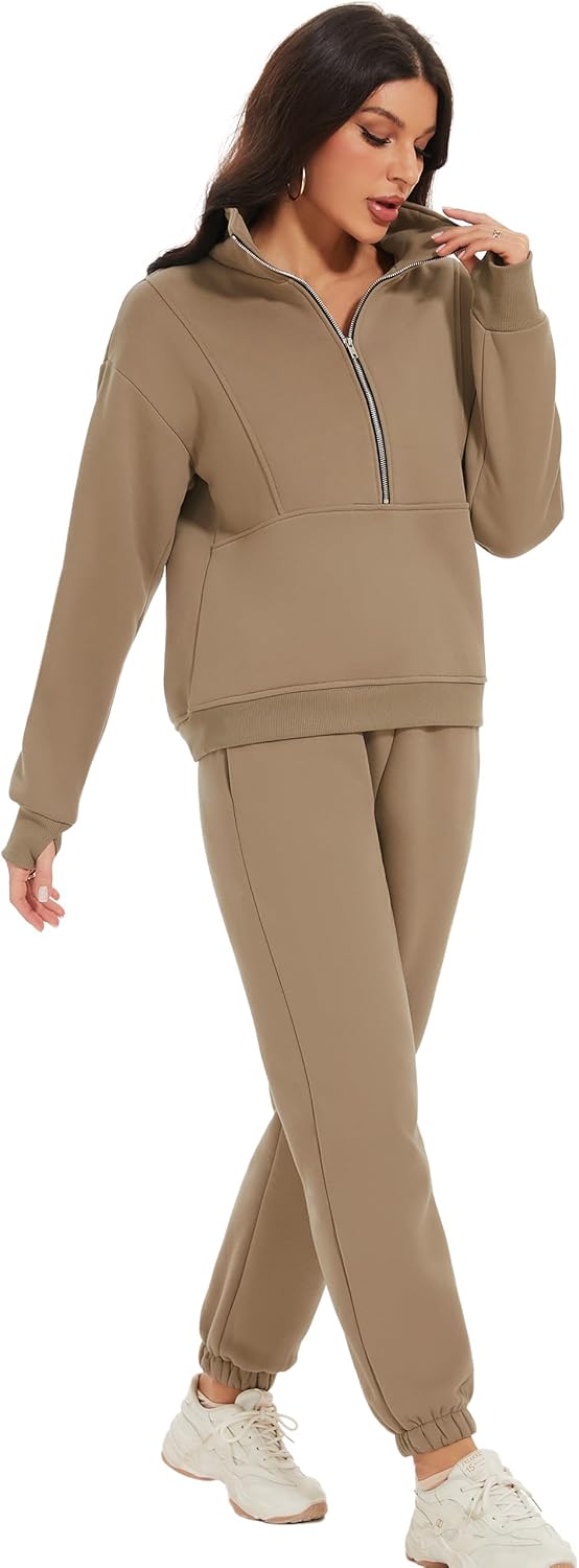 Woman wearing a beige tracksuit on a white background