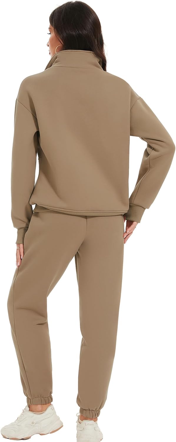 Woman wearing a beige tracksuit on a white background