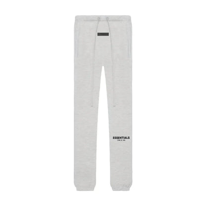 Gray sweatpants with 'ESSENTIALS' logo on a white background