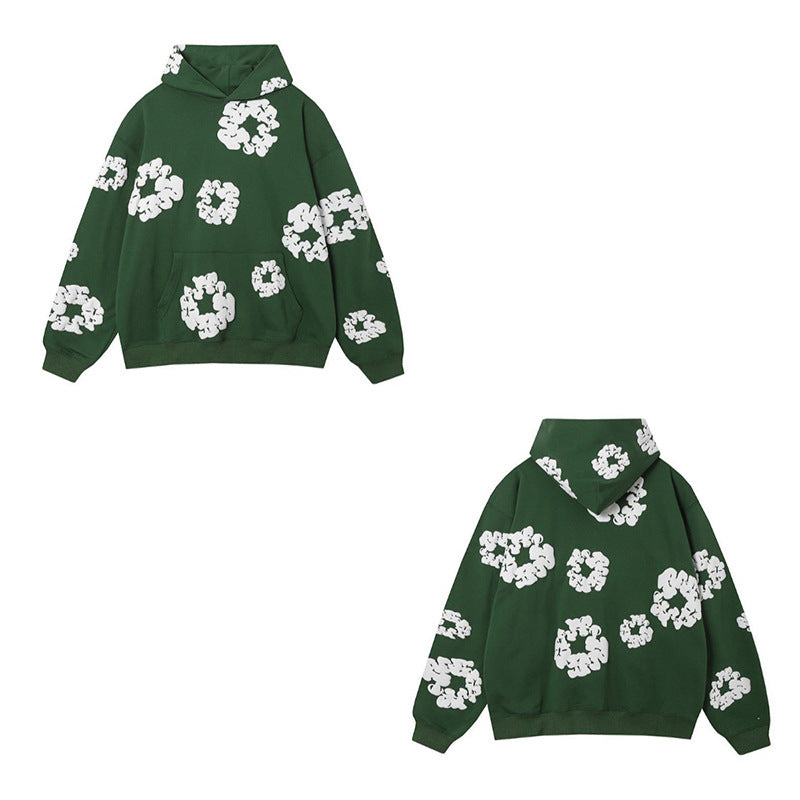 Green hoodie with white floral patterns on a white background