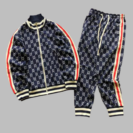 Navy tracksuit with red and yellow accents on a gray background