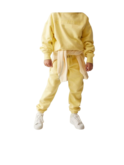 Person wearing a yellow tracksuit with a white background