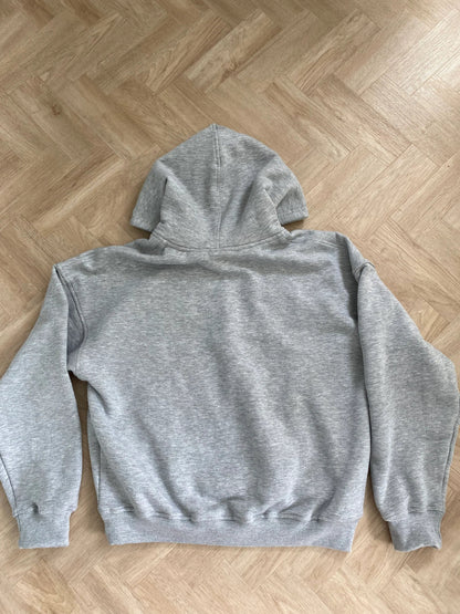 Gray hoodie on a wooden floor