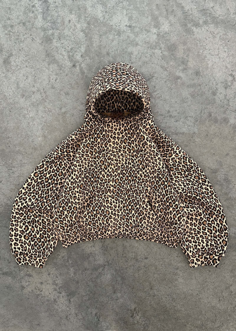 Leopard print poncho on a gray background