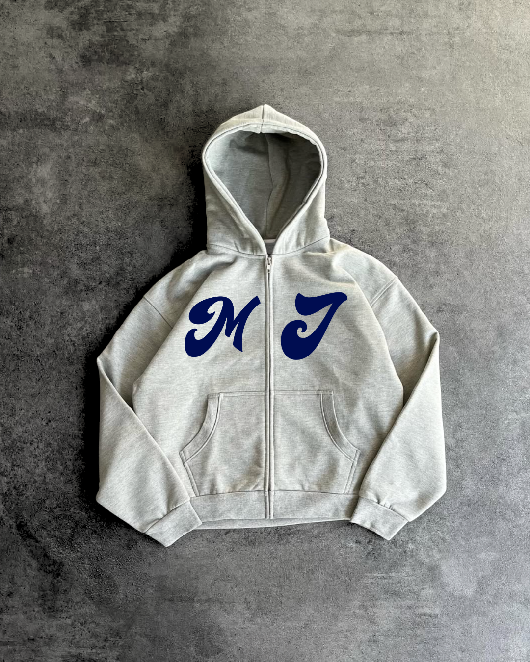 Gray hoodie with blue 'MJ' letters on a gray background