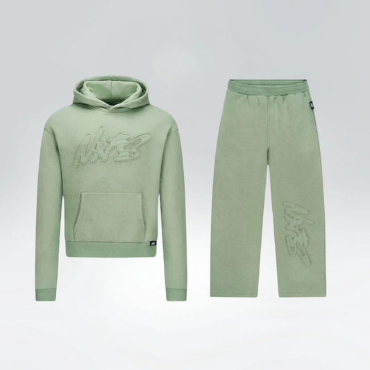 Green hoodie and pants set on a light gray background