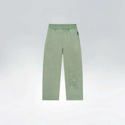 Green pants with a brand logo on a light gray background