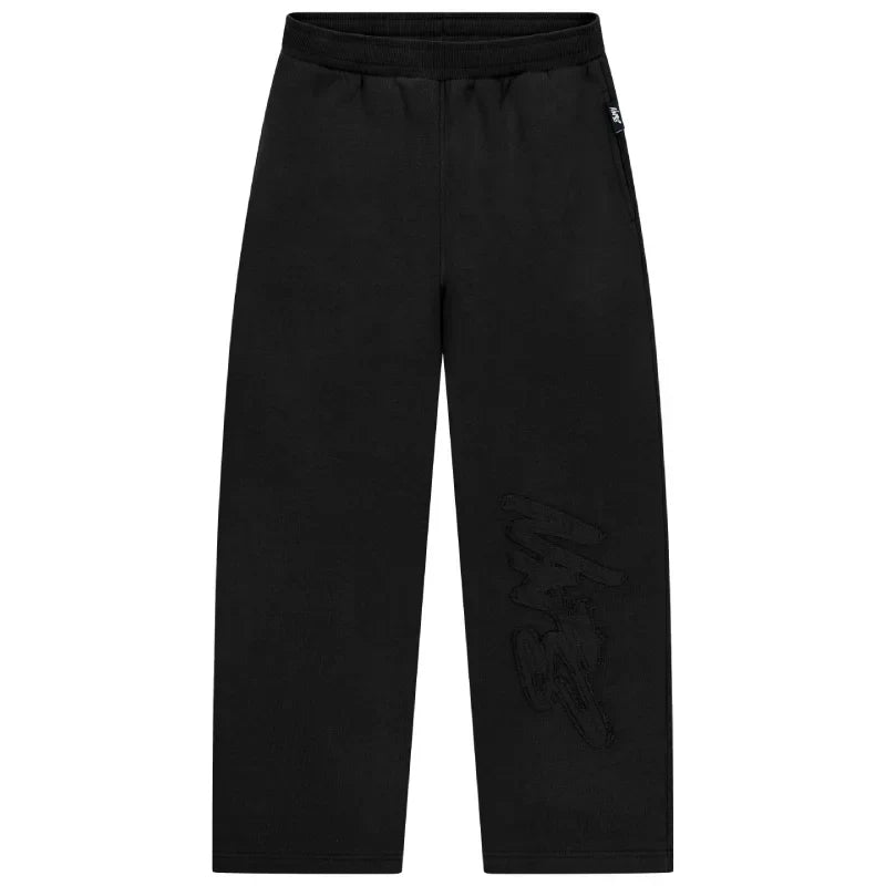 Black pants with a small logo on a white background