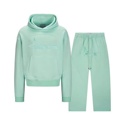 Mint green hoodie and pants set on a white background