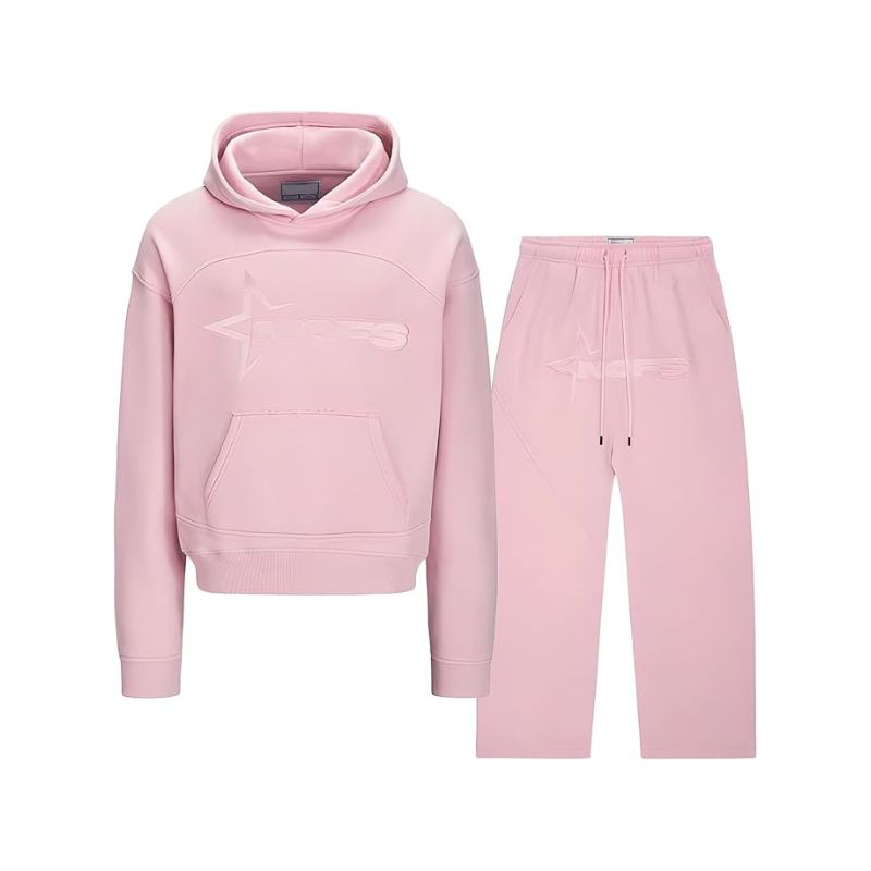 Pink hoodie and pants set on a white background