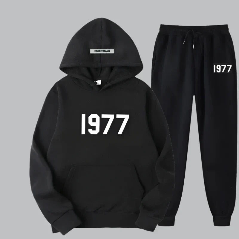 Black hoodie and pants set with '1977' text on a gray background