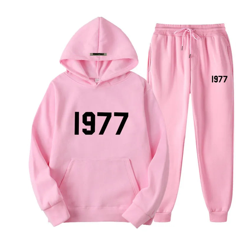 Pink hoodie and pants set with '1977' text on a white background