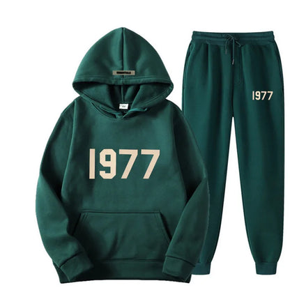 Green hoodie and pants set with '1977' text on a white background