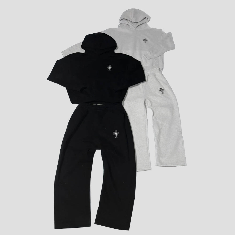 Black and gray tracksuits with a brand logo on a light gray background