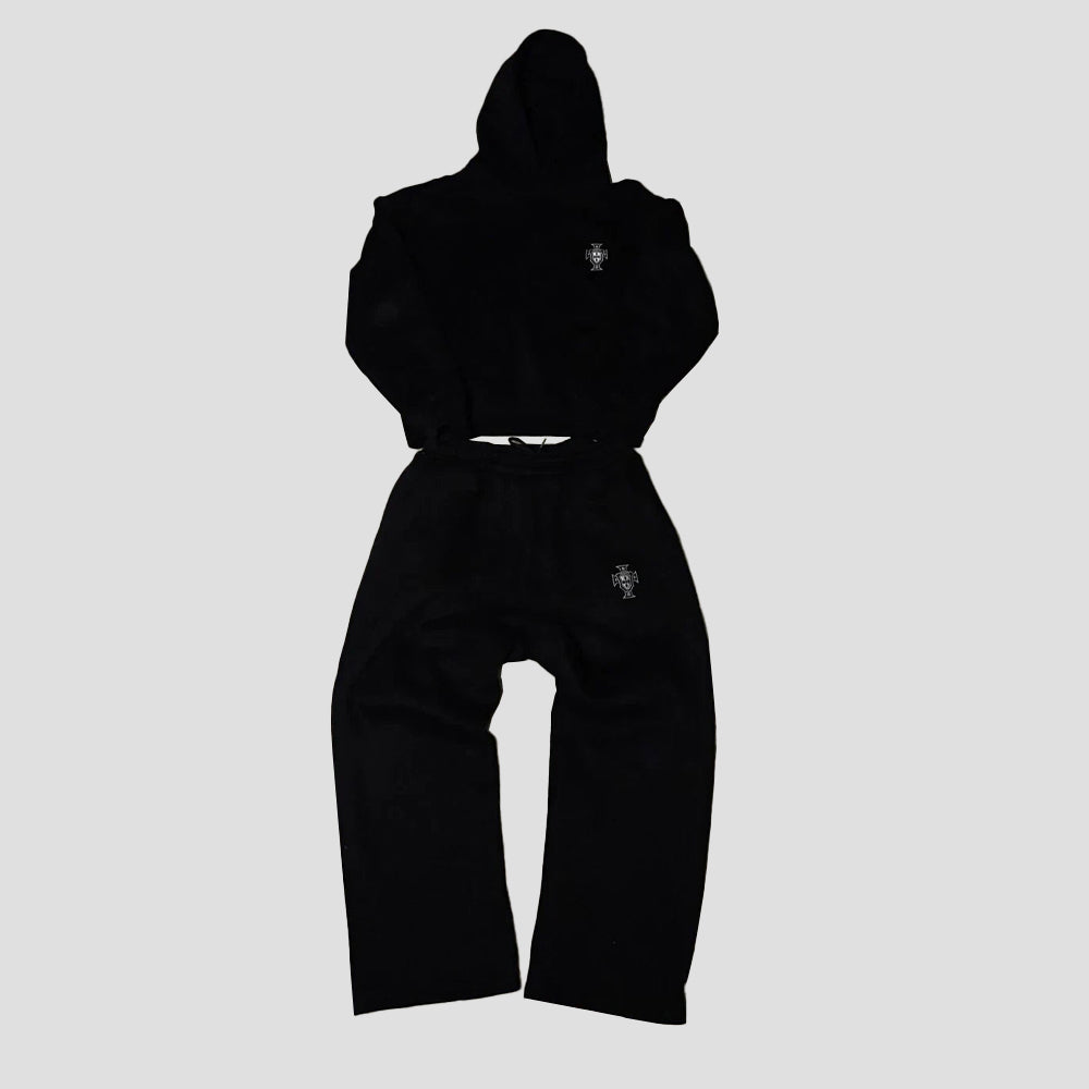 Black hoodie and pants set on a light gray background