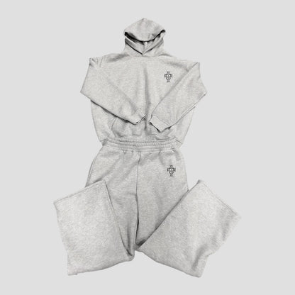 Gray tracksuit with a logo on a light gray background