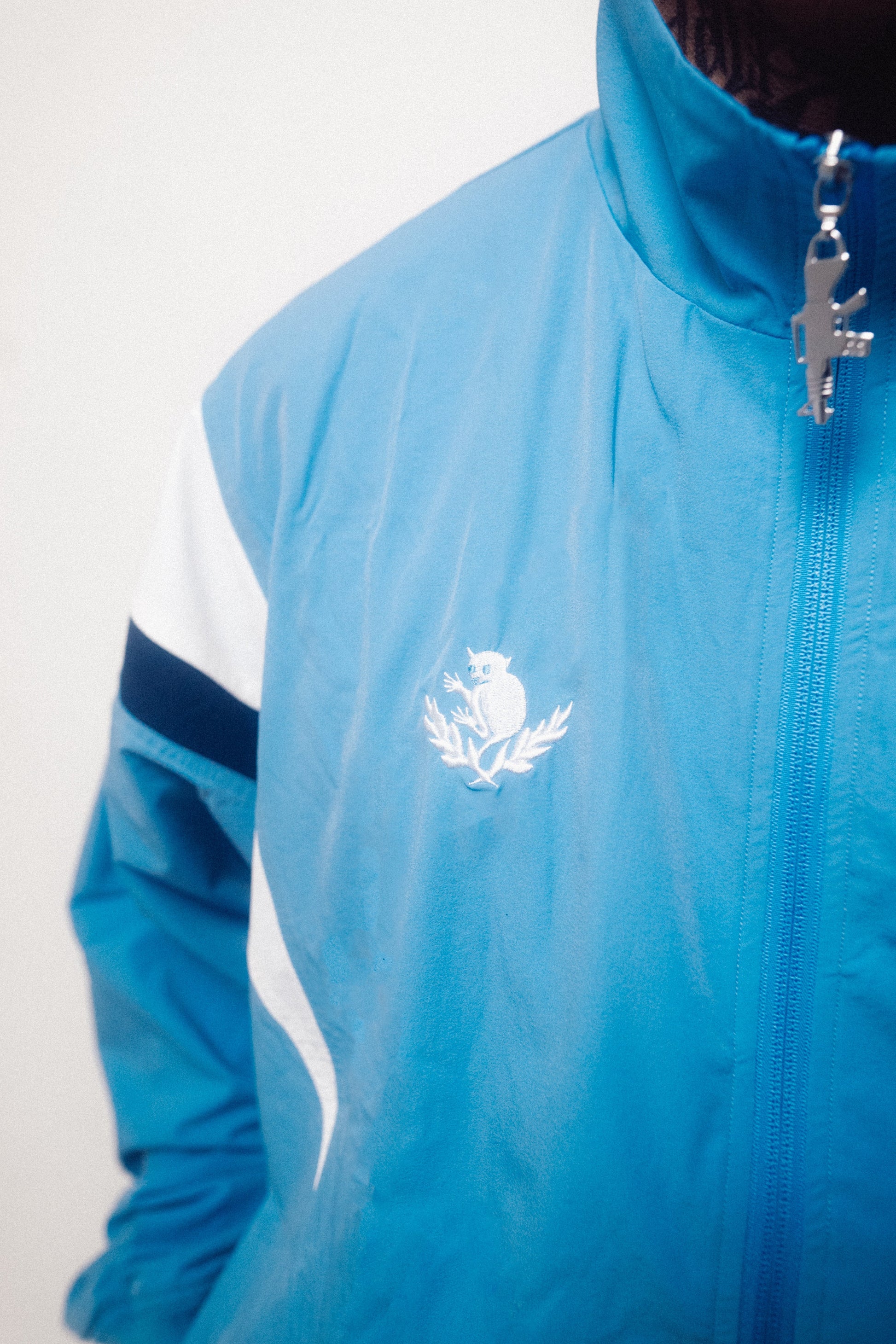 Blue jacket with a logo on a white background