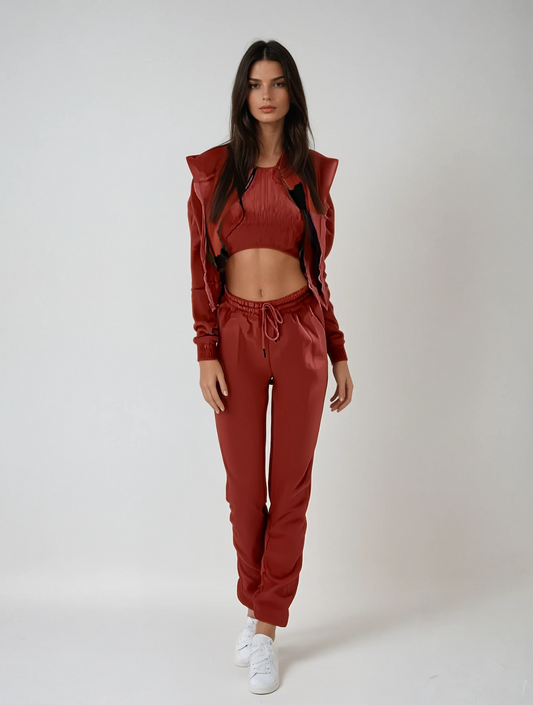 Woman wearing a red tracksuit on a white background