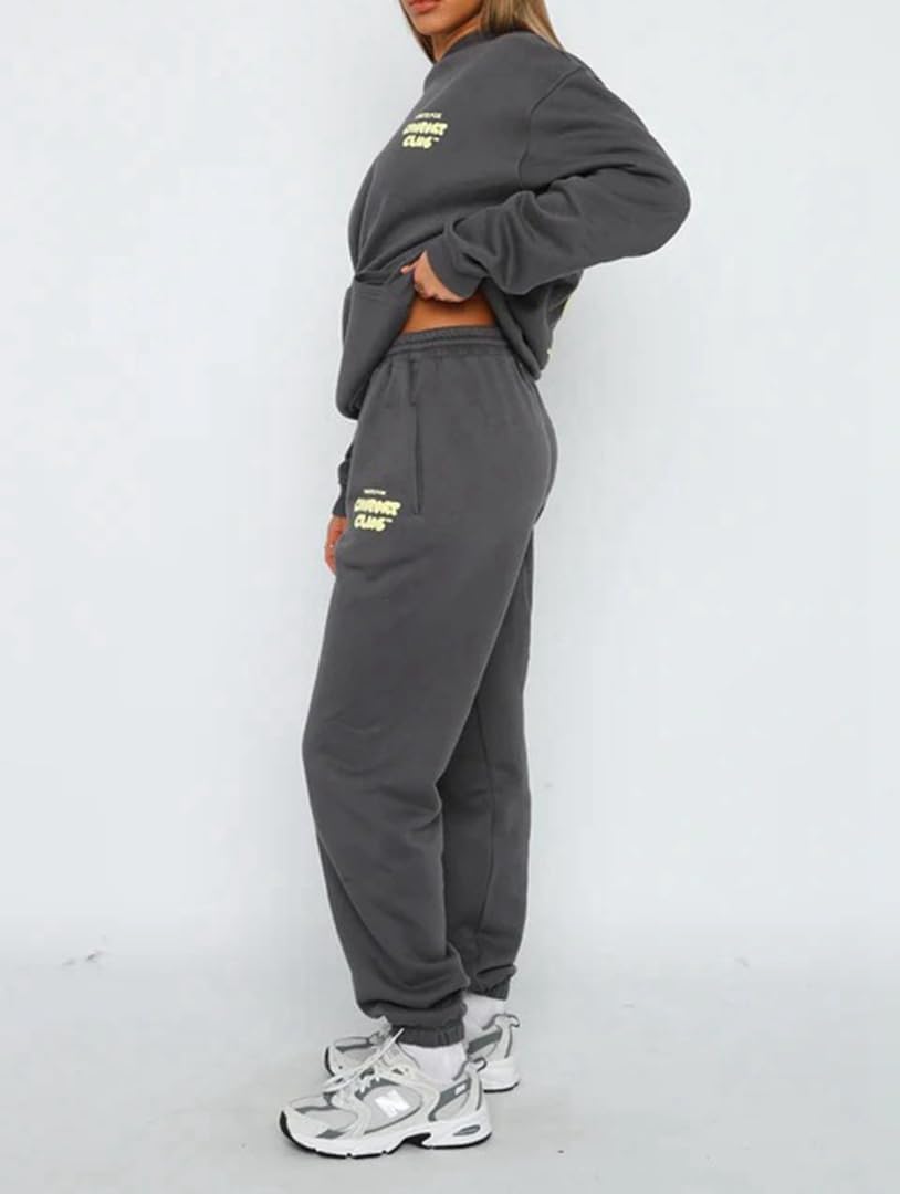 Person wearing a gray tracksuit with yellow text on a white background