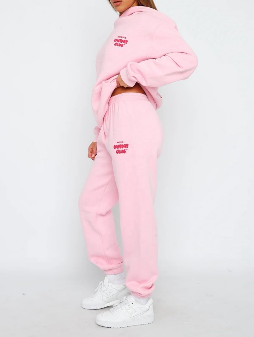 Person wearing a pink tracksuit with text on a white background