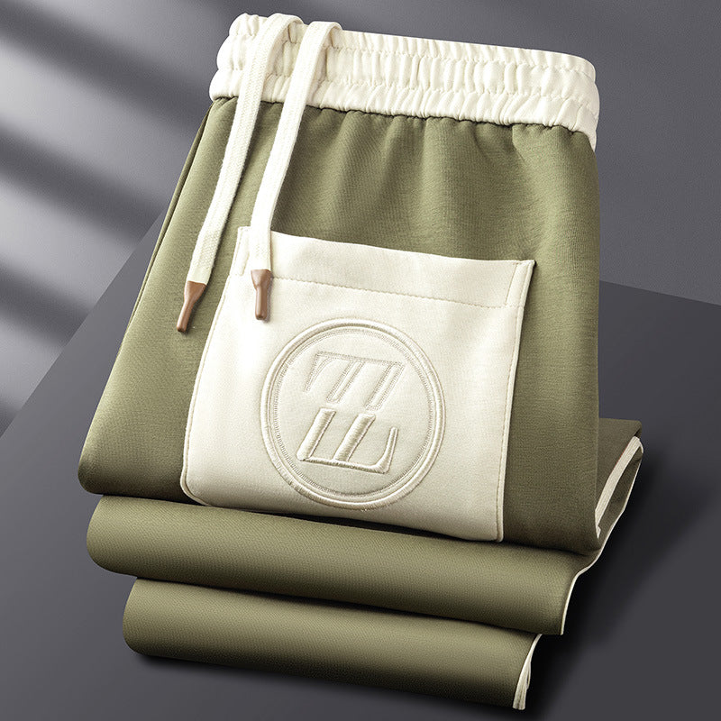 Green and white bag with a logo on a gray background